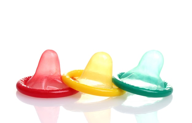 Colorful condoms isolated on white