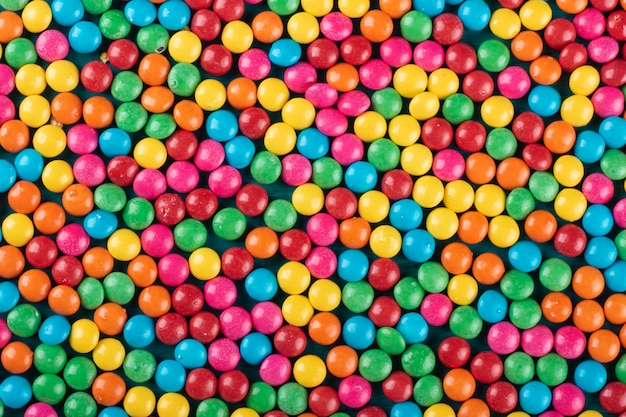 Colorful Confetti candy background texture top view.