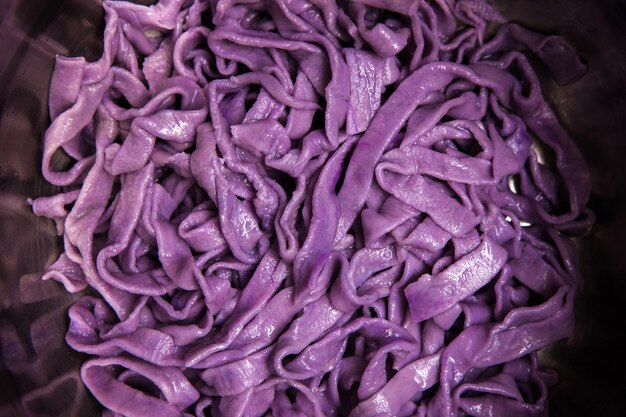 Colorful cooked tagliatelle closeup