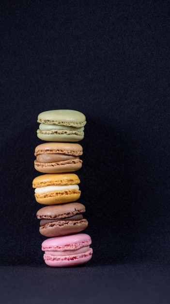 Colorful cookies on black background