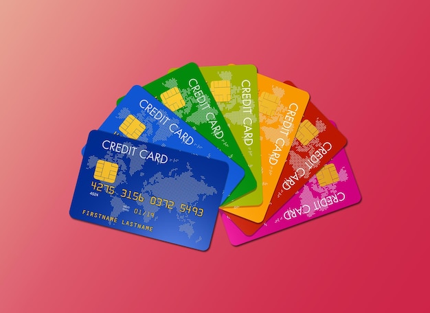 Colorful credit cards isolated on a pink background