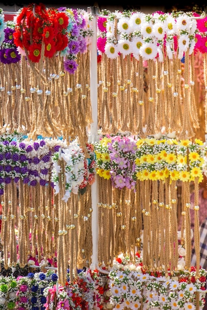 Colorful crowns for sale made of fake flowers