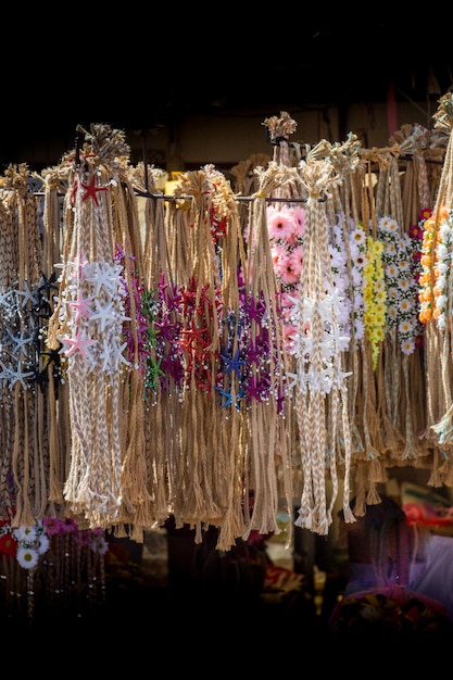 Colorful crowns for sale made of fake flowers