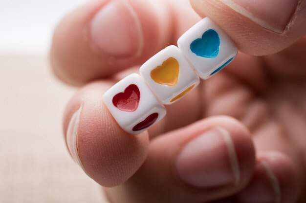 Colorful cubes with a heart in hand