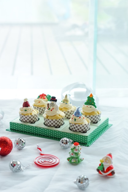 Colorful cupcake with Christmas decorations.