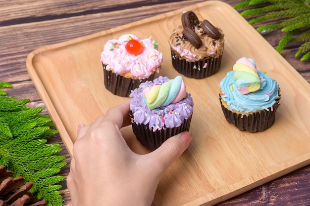 Colorful Cupcakes on wooden table