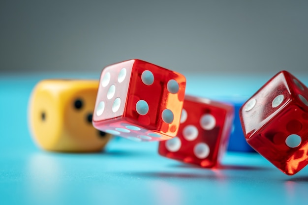 Colorful dices on the green table. The concept of a casino and a lucky chance to win