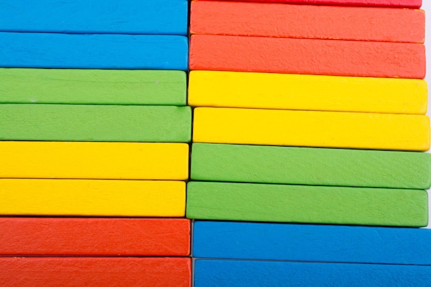 Colorful Domino Blocks in a line on a white background