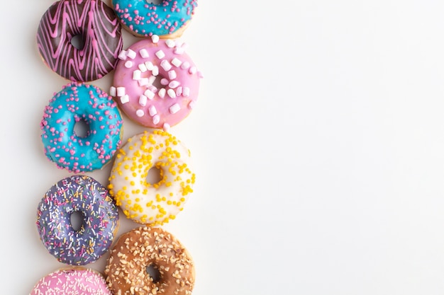 Colorful donuts arrangement copy space