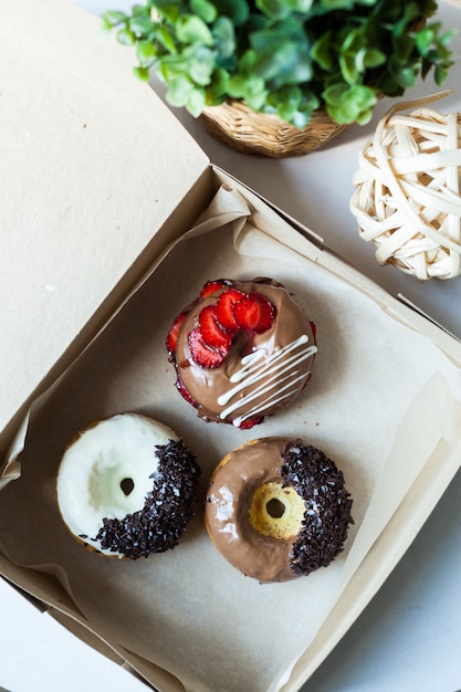 Colorful donuts in box