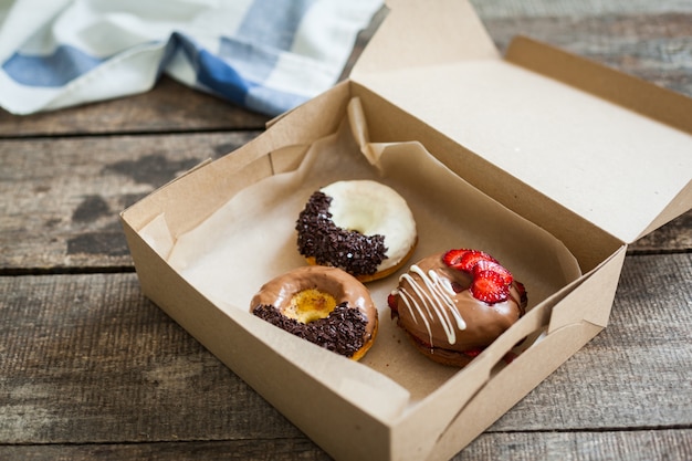 Colorful donuts in box