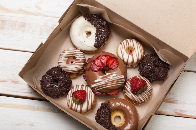 Colorful donuts in box