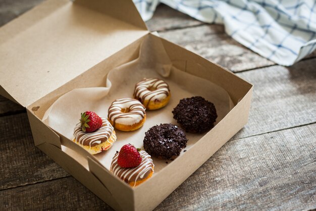 Colorful donuts in box