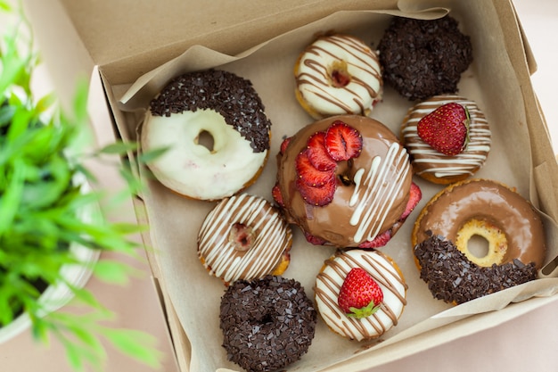 Colorful donuts in box