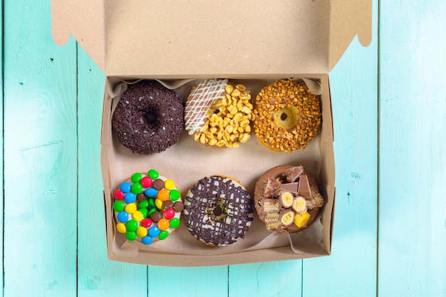 Colorful donuts in box