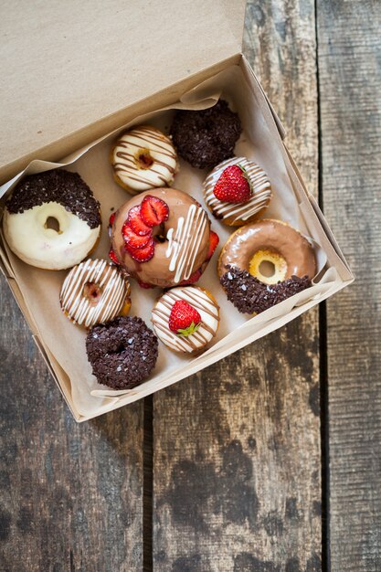 Colorful donuts in box