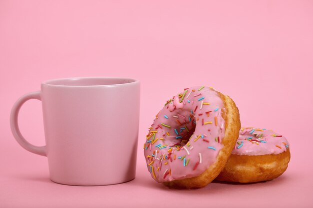 Colorful Donuts Breakfast Composition with Pink Color Styles. Game of colors, pink on pink. Sweet life, vanilla breakfast.