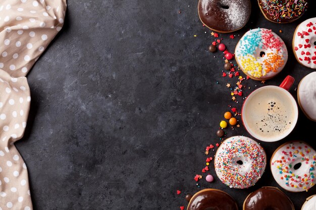 Colorful donuts and coffee cup