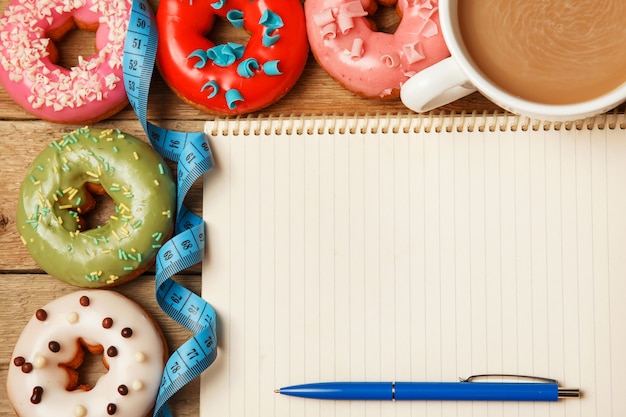 Colorful donuts and notepad