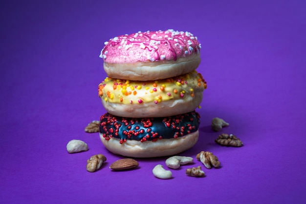 Colorful donuts on pastel background Cafe food Studio product shoot