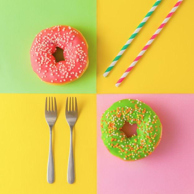 Colorful donuts on a yellow background