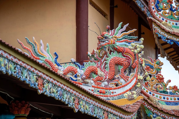 Colorful dragon sculpture on the roof In a Buddhist temple in Danang Vietnam