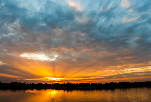 Colorful dramatic sky with cloud at sunset.