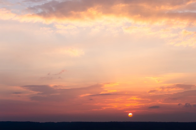 Colorful dramatic sky with cloud at sunset.