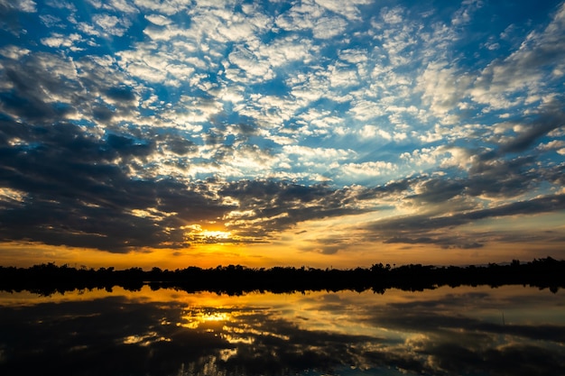 Colorful dramatic sky with cloud at sunset.