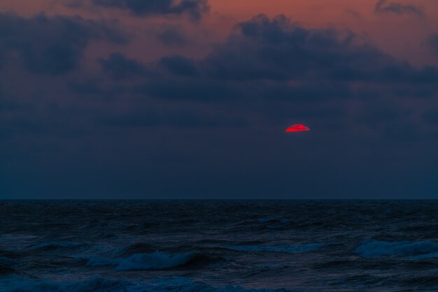 Colorful dramatic sunset on the coast