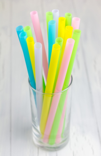 Colorful drinking straws in the glass