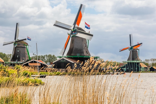 Colorful Dutch Windmills at the river Zaan Zaanse Schans Zaandam The Netherlands