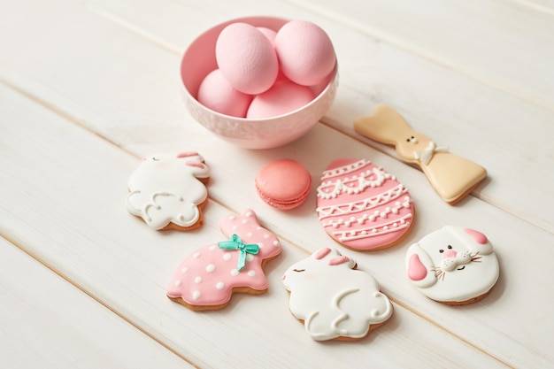 Colorful easter cookies and pink eggs