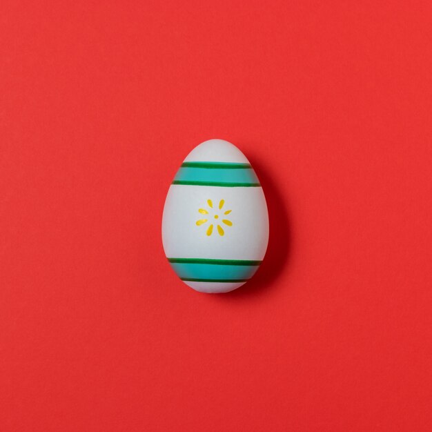 Colorful easter egg on red.