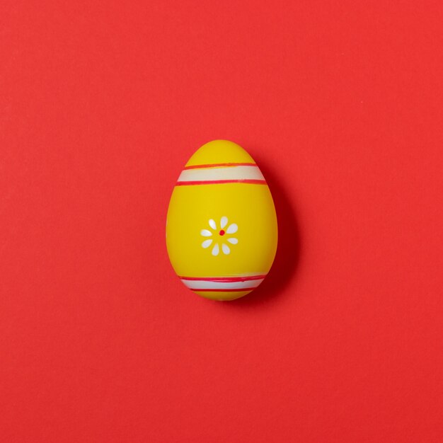 Colorful easter egg on red.