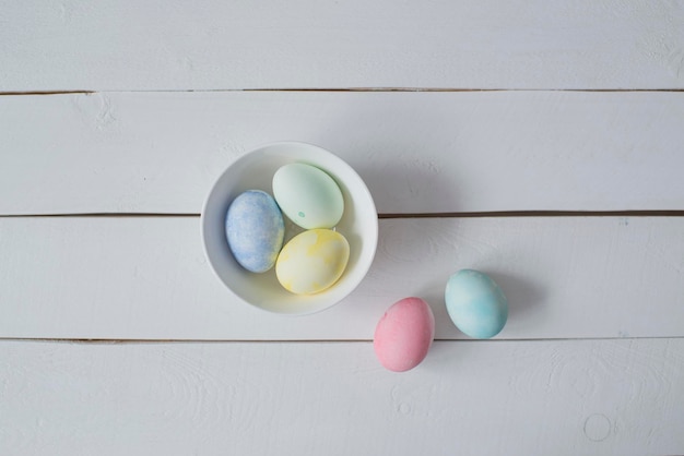 Colorful Easter eggs are lying on the table