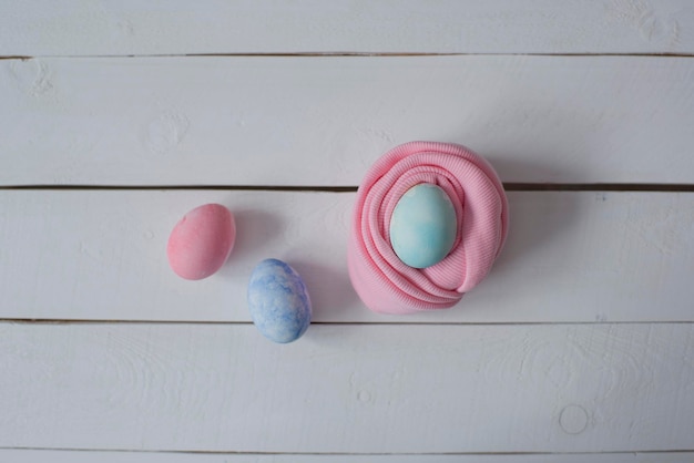 Colorful Easter eggs are lying on the table