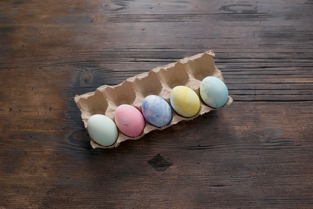 Colorful Easter eggs are lying on the table