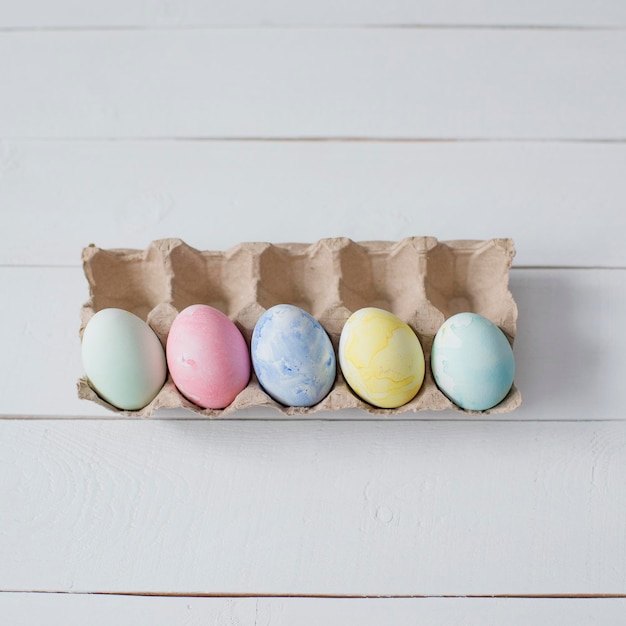 Colorful Easter eggs are lying on the table