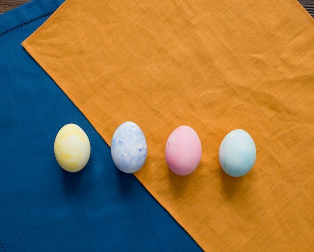 Colorful Easter eggs are lying on the table