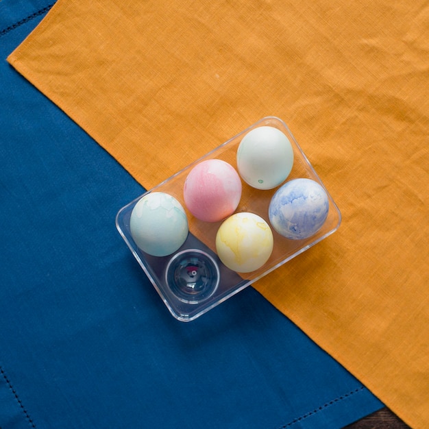 Colorful Easter eggs are lying on the table