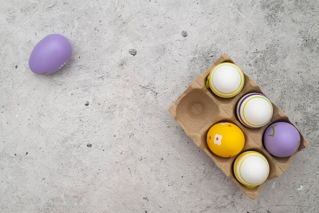 Colorful Easter eggs background on the concrete background