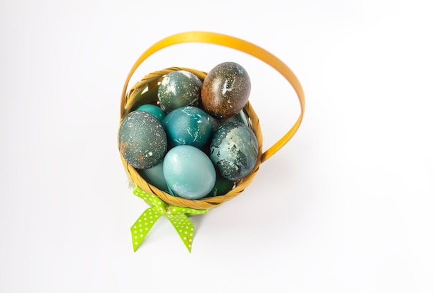 Colorful Easter eggs in a basket Traditional festive decor