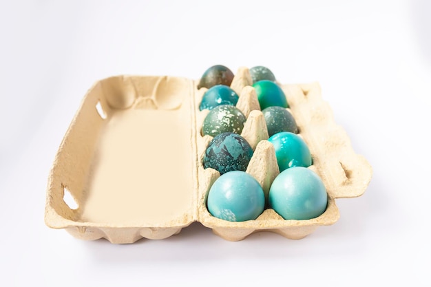 Colorful Easter eggs in cardboard box Traditional festive decor