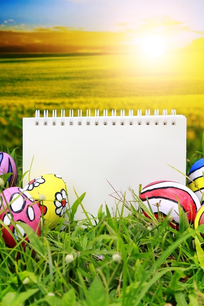 colorful Easter Eggs celebration Spring event background with blank notebook template