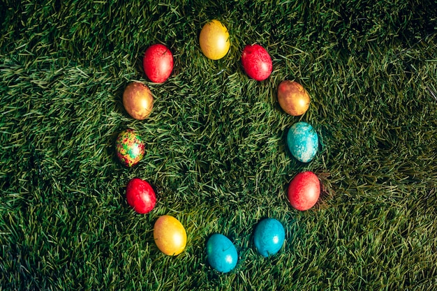 Colorful Easter eggs on the grass