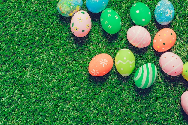 Colorful easter eggs on green grass