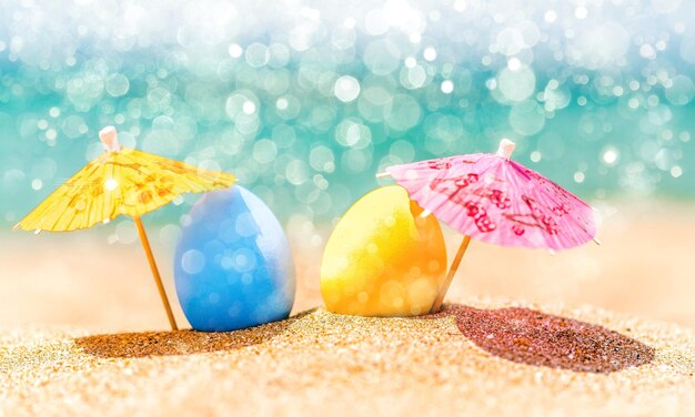 Colorful easter eggs on ocean beach