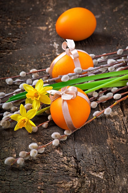 Colorful easter eggs on old wooden background