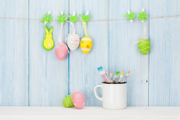 Colorful easter eggs and paintbrushes